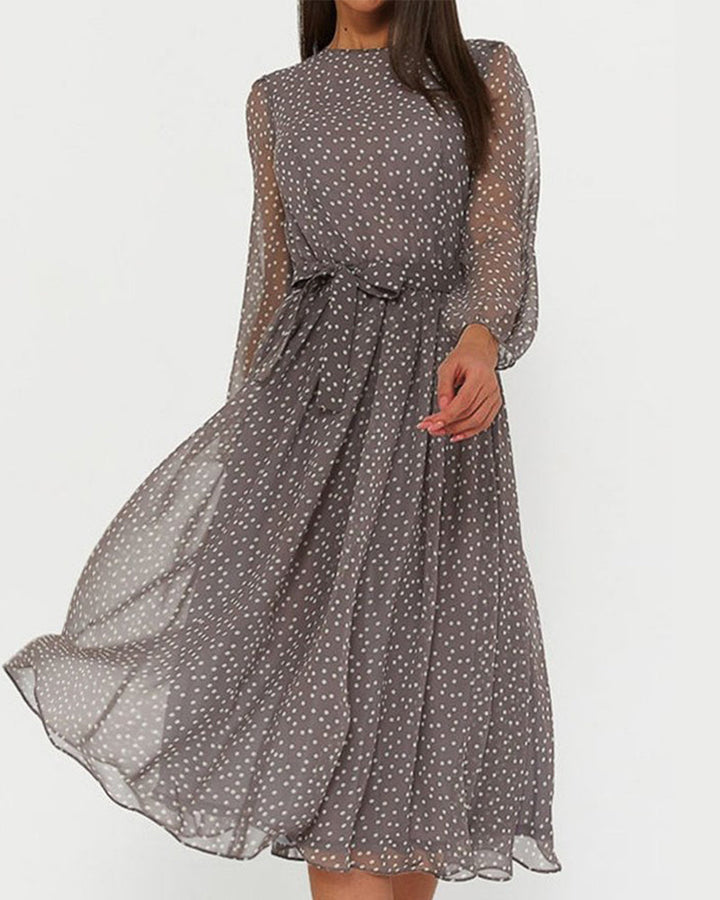 Women's elegant A-line polka dot dress with stylish lantern sleeves, perfect for versatile spring and summer wear.