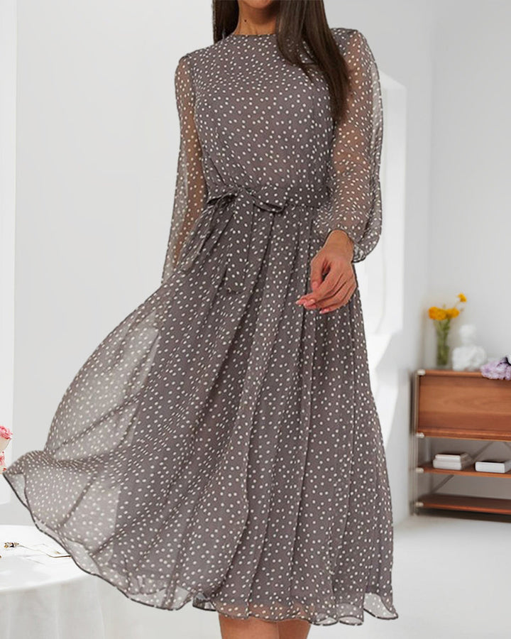 Casual women's A-line polka dot dress with lantern sleeves, ideal for autumn elegance and comfortable daily wear.