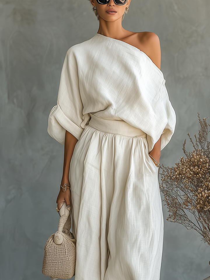 Close-up: Detail of women's asymmetric drape top, a key piece in this elegant two-piece pant set, minimalist style.