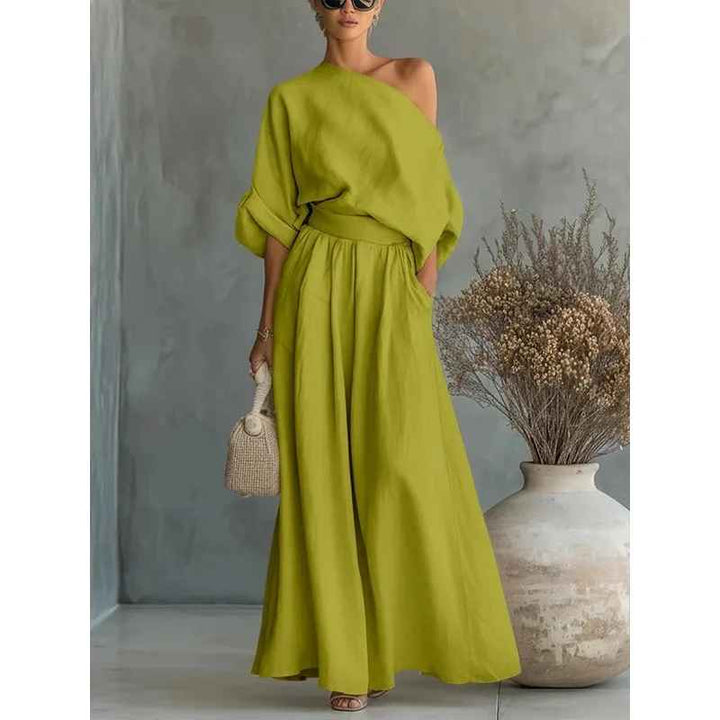 Fabric detail: Soft material of a women's asymmetric drape top & tapered pant set, highlighting luxury fashion & comfort.