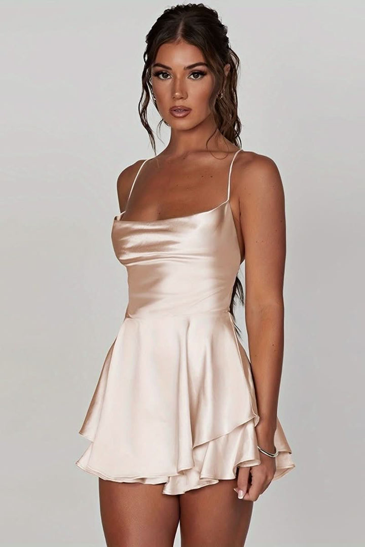 Close-up of ruched detail on an elegant women's halter cocktail dress. Perfect for evening parties.
