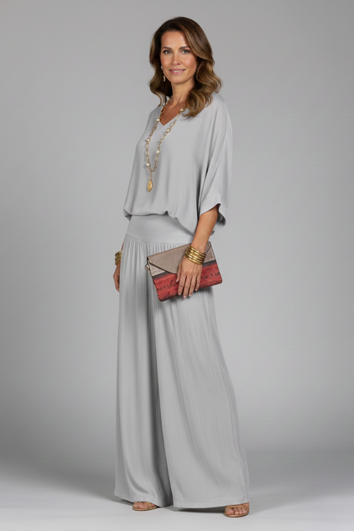 Resort wear women's batwing top & wide leg pant set in a relaxed, elegant fit. Summer outfit essential.