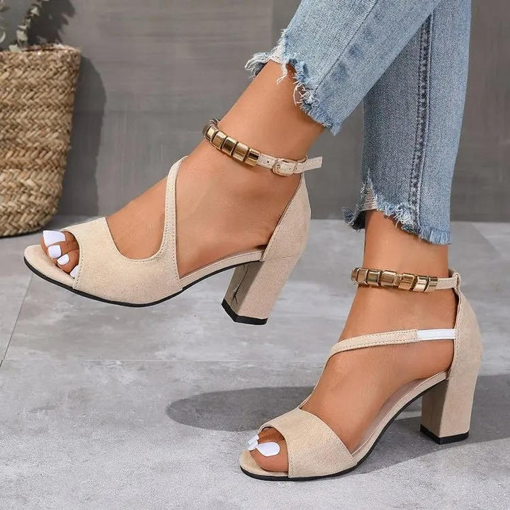 Dressy women's sandals featuring a sparkling beaded ankle strap and stable block heel.