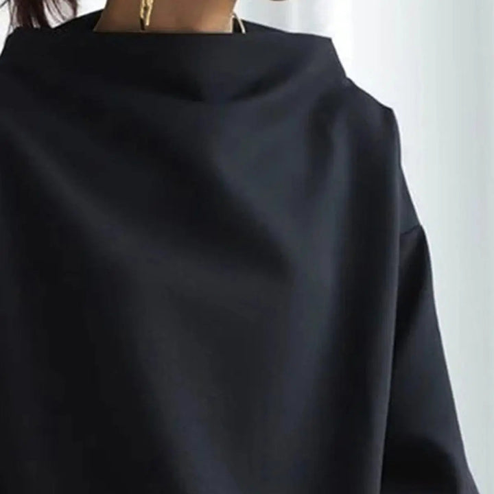 Women's elegant blue high-neck top with long sleeves, offering a sophisticated look for work or casual chic layering.