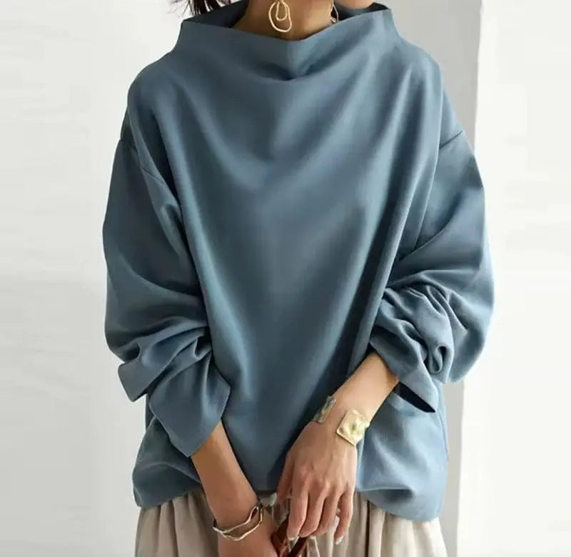 Elegant high-neck long-sleeve top for women in black, blue, or white, a sophisticated and versatile wardrobe essential.