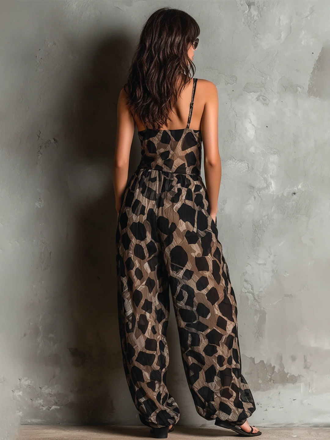 Stylish women's black leopard print v-neck wrap maxi dress. Elegant sleeveless design for parties & vacations.