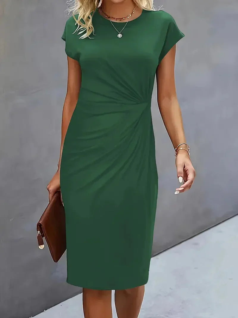 Close-up of the elegant round neck on a flattering women's midi dress, versatile for styling.