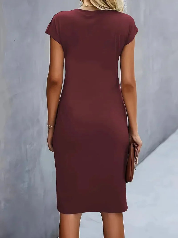 Formal wear: elegant women's midi dress, flattering round neck, a versatile choice for events.