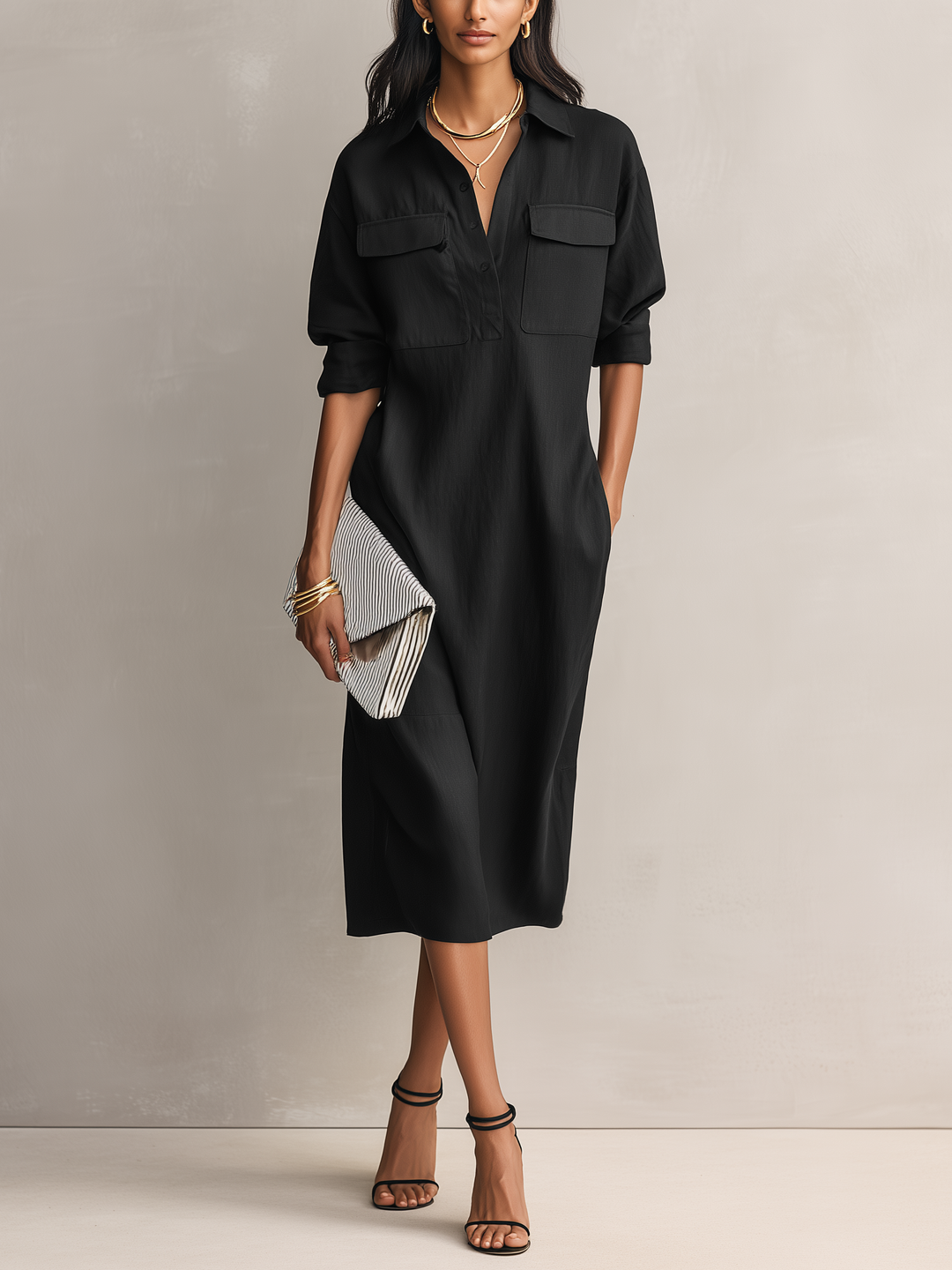 Women's elegant black midi dress with a stylish shirt collar & short sleeves. Perfect for sophisticated looks.
