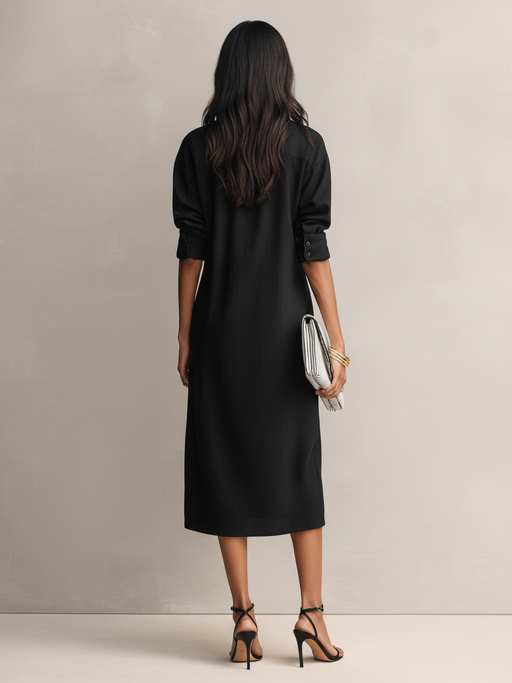 Sophisticated women's black midi dress featuring a classic shirt collar & comfy short sleeves for an elegant style.