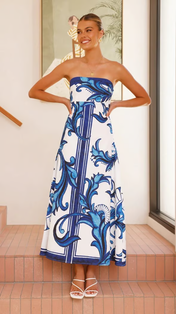 Women's elegant blue flowy midi dress with short sleeves & unique print. Perfect versatile summer dress.