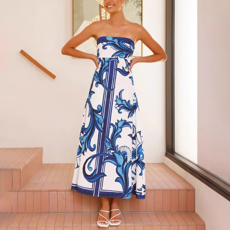 Elegant women's flowy midi dress, short sleeve with a vibrant blue print. Ideal for summer parties.