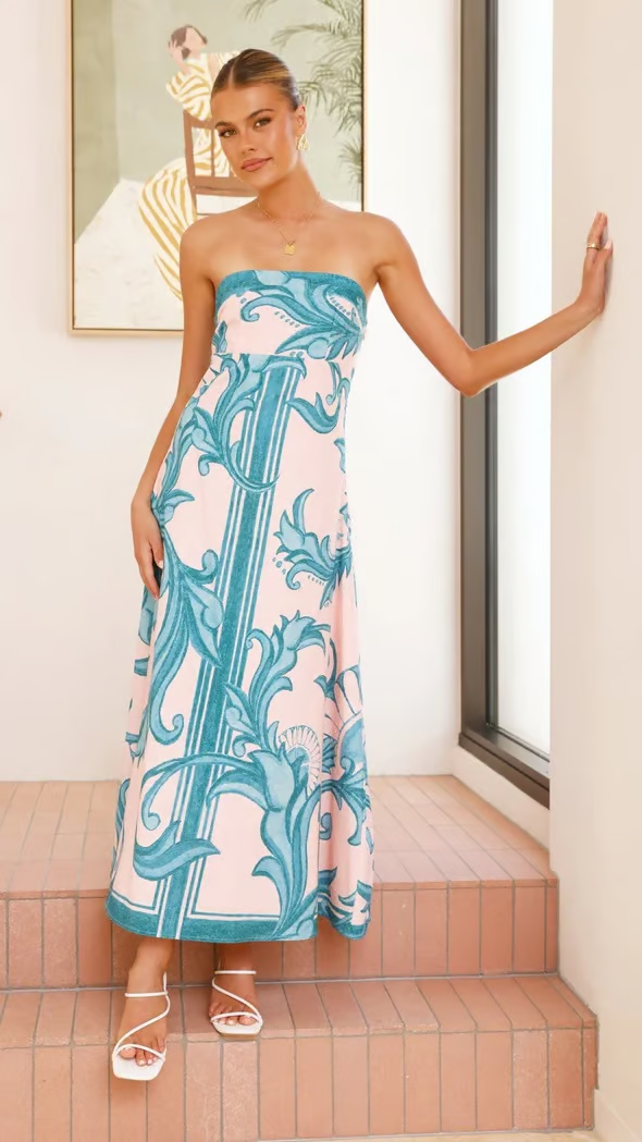 Versatile women's blue printed dress. Flowy short sleeve midi for casual or elegant occasions.