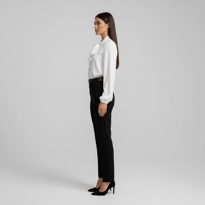 Chic women's puff sleeve top, featuring a bow tie neck. An elegant and versatile long sleeve blouse.