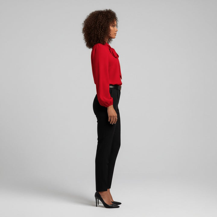 Elegant women's bow tie neck long sleeve blouse with fashionable puff sleeves.
