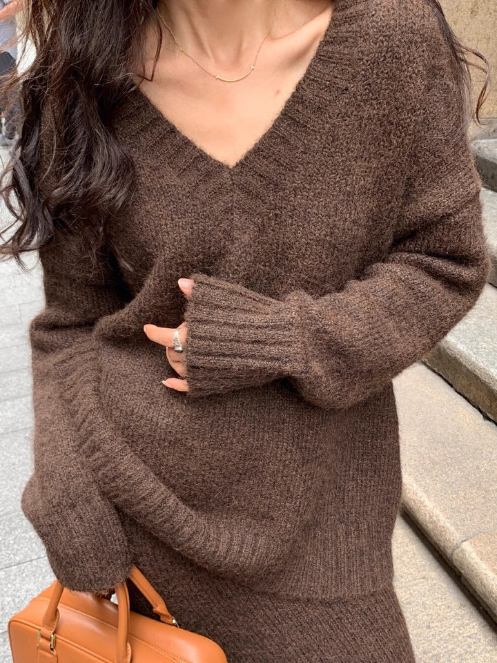 Gray V-neck long sleeve sweater and matching midi skirt set, a chic two-piece women's elegant outfit.