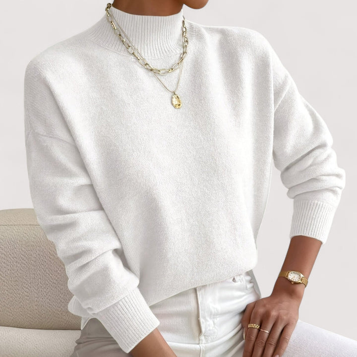 Women's elegant cozy turtleneck sweater in solid color, perfect for warm winter style and comfort.