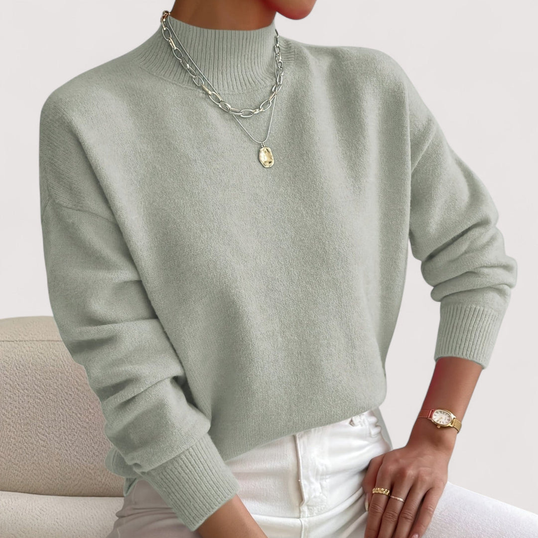 Elegant women's turtleneck sweater, a cozy long-sleeve knit pullover, perfect for chic winter style.