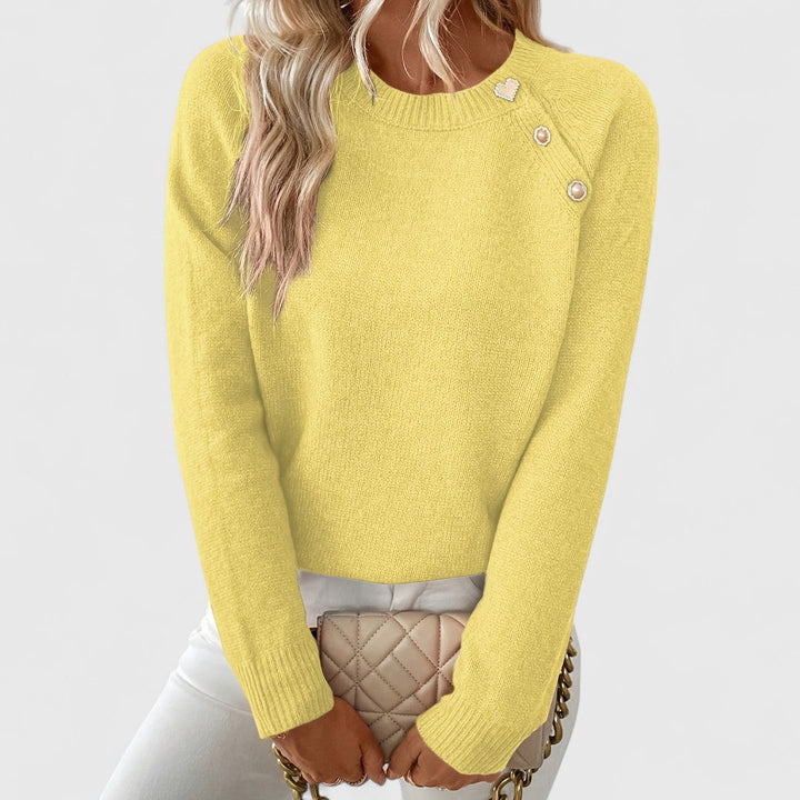 Sophisticated women's sweater: crew neck pullover with elegant pearl button shoulder and long sleeves.