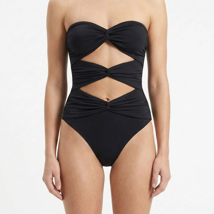Designer-inspired women's cutout swimsuit & matching resort skirt. Perfect resort wear.
