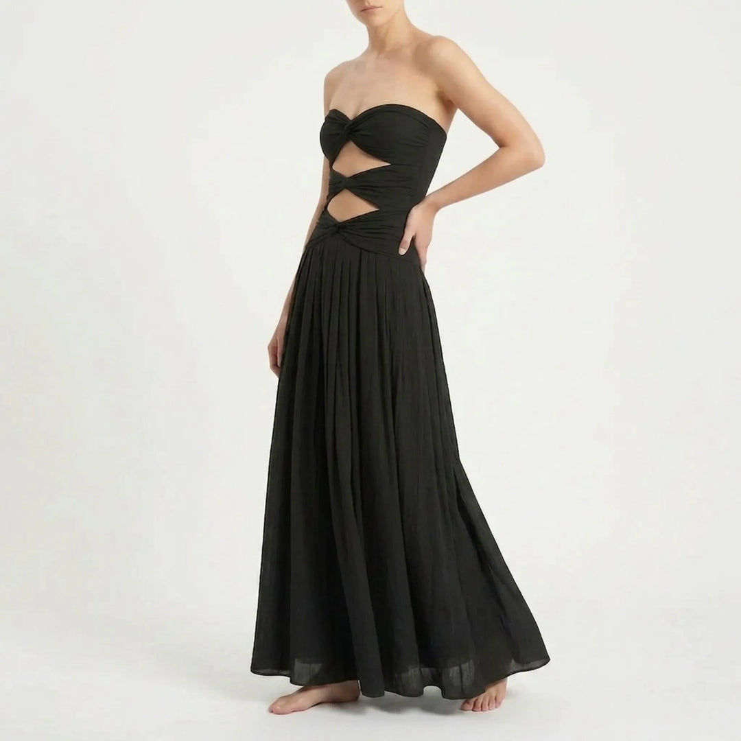 Elegant women's one-piece cutout monokini, paired with a breezy resort skirt. Vacation style.