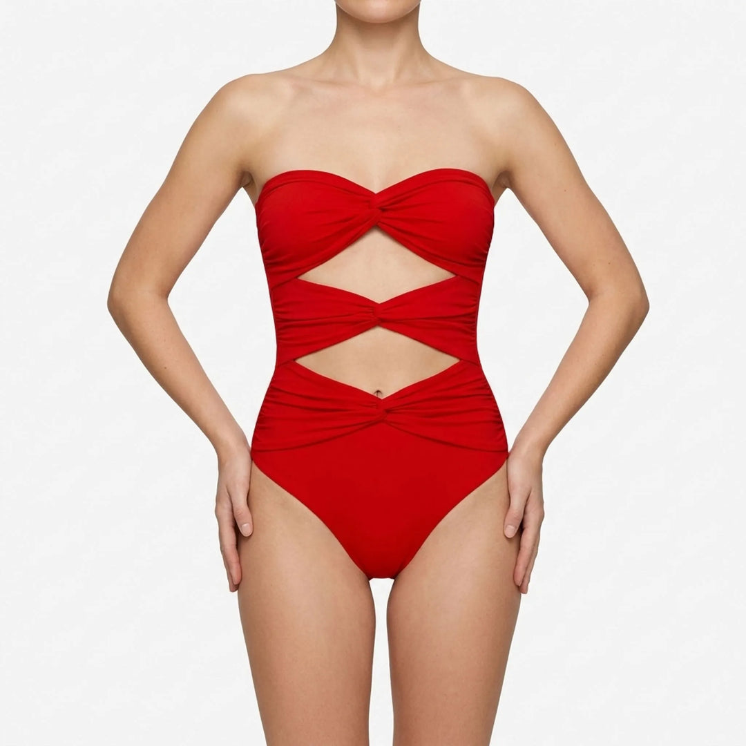 Women's fashionable cutout swimsuit & coordinating resort skirt for an elegant vacation look.