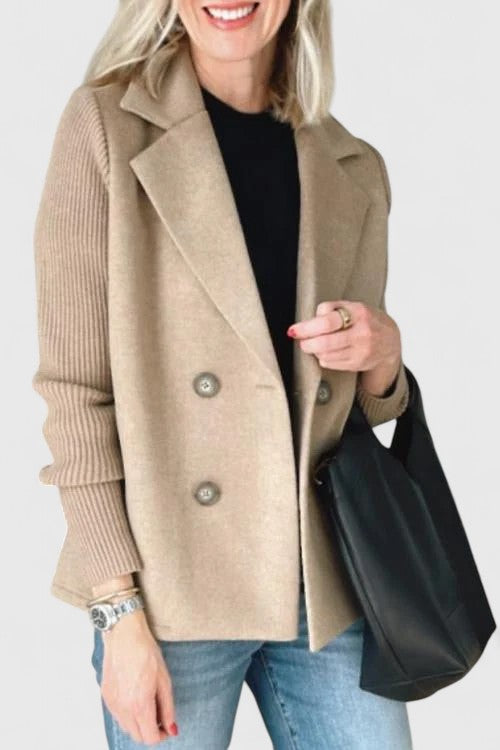 Stylish women's double-breasted blazer, perfect for layering over professional or casual outfits.