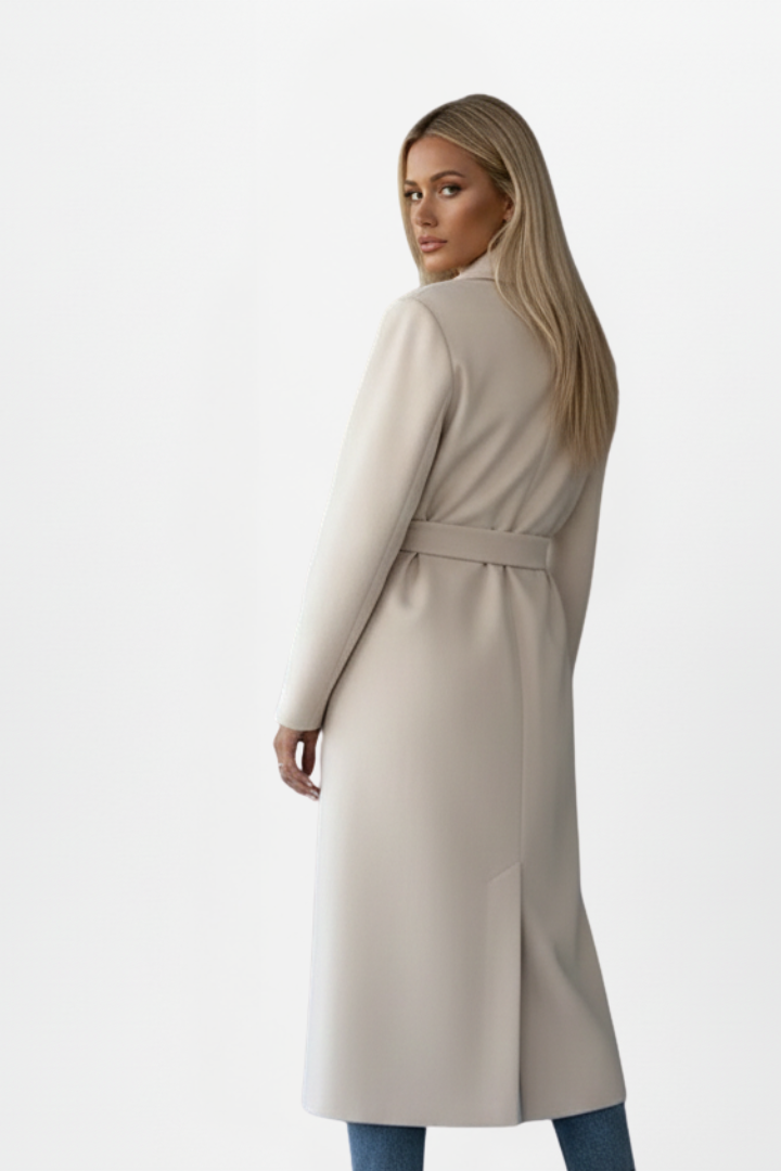 Chic women's long belted coat, double-breasted, exuding elegance for sophisticated fall & winter fashion.