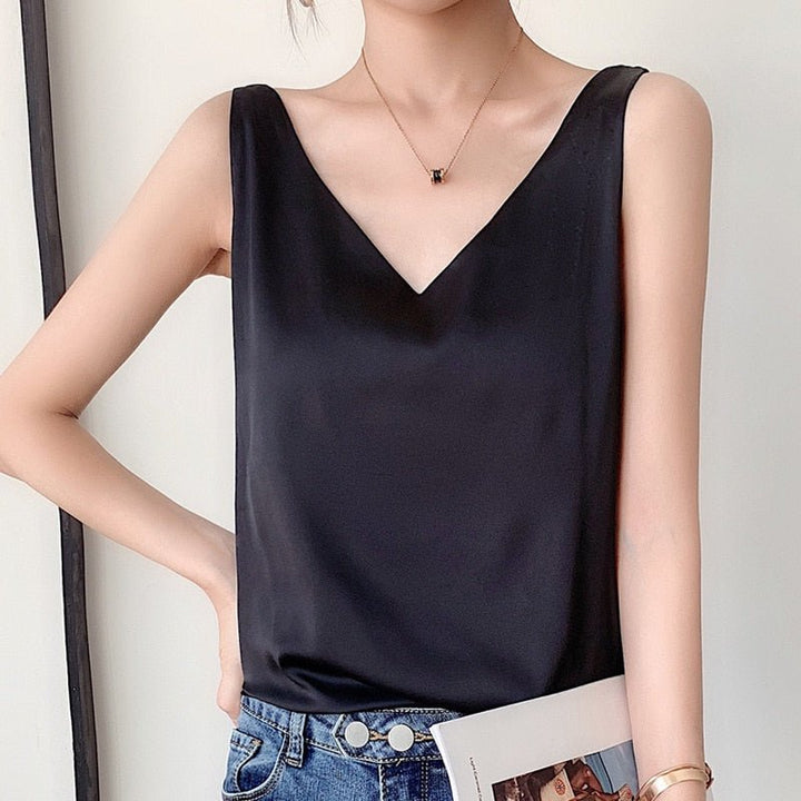 Women's elegant draped tank top in a relaxed fit for versatile summer style.
