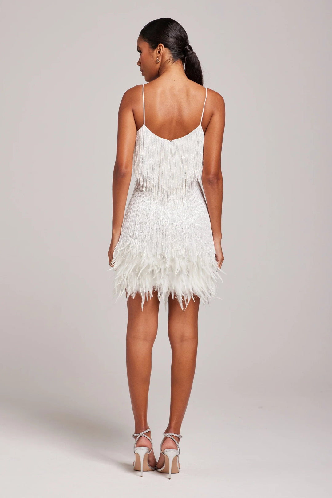 Stunning women's fitted feather fringe mini dress, ideal for glamorous evening wear.