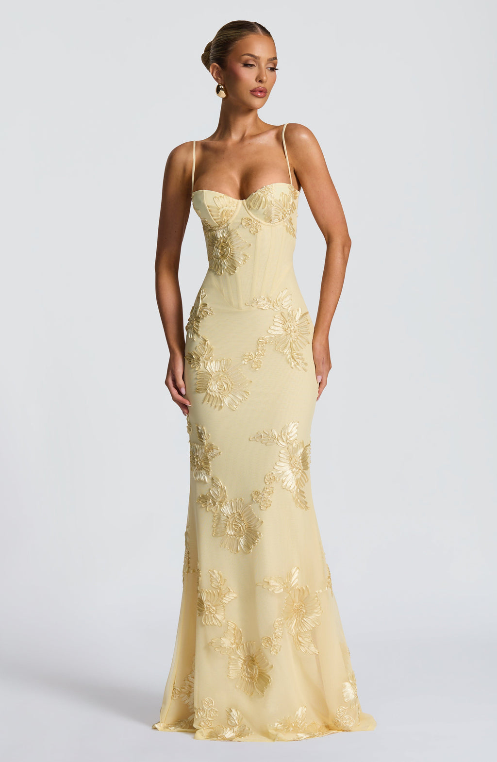 Stunning floral appliqué detailing on a women's corset bodice mermaid maxi dress, ideal for prom or formal events.
