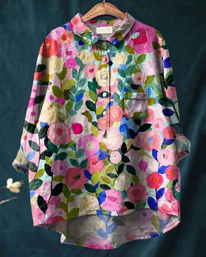 Women's elegant floral blouse with a vibrant flower print, a comfortable loose-fit long sleeve top.