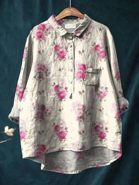 Elegant women's blouse featuring a delicate flower print, perfect for spring and summer fashion.