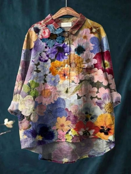 Back view of a comfortable women's floral blouse, highlighting the elegant flower print and relaxed fit.