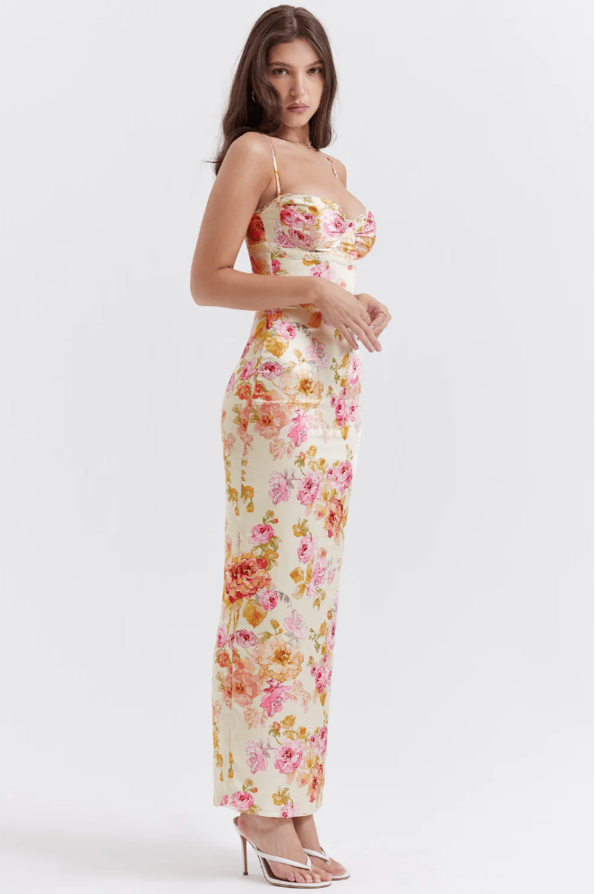 Sophisticated floral corset slip maxi dress, blending structure with flow, perfect for a wedding guest.