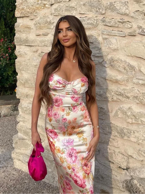 Beautiful floral maxi slip dress, a stylish summer wedding guest outfit with a flattering corset design.