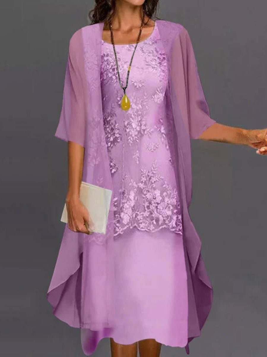 Beautiful women's floral embroidered dress with a flowing asymmetrical hem & three-quarter sleeves, ideal for summer.
