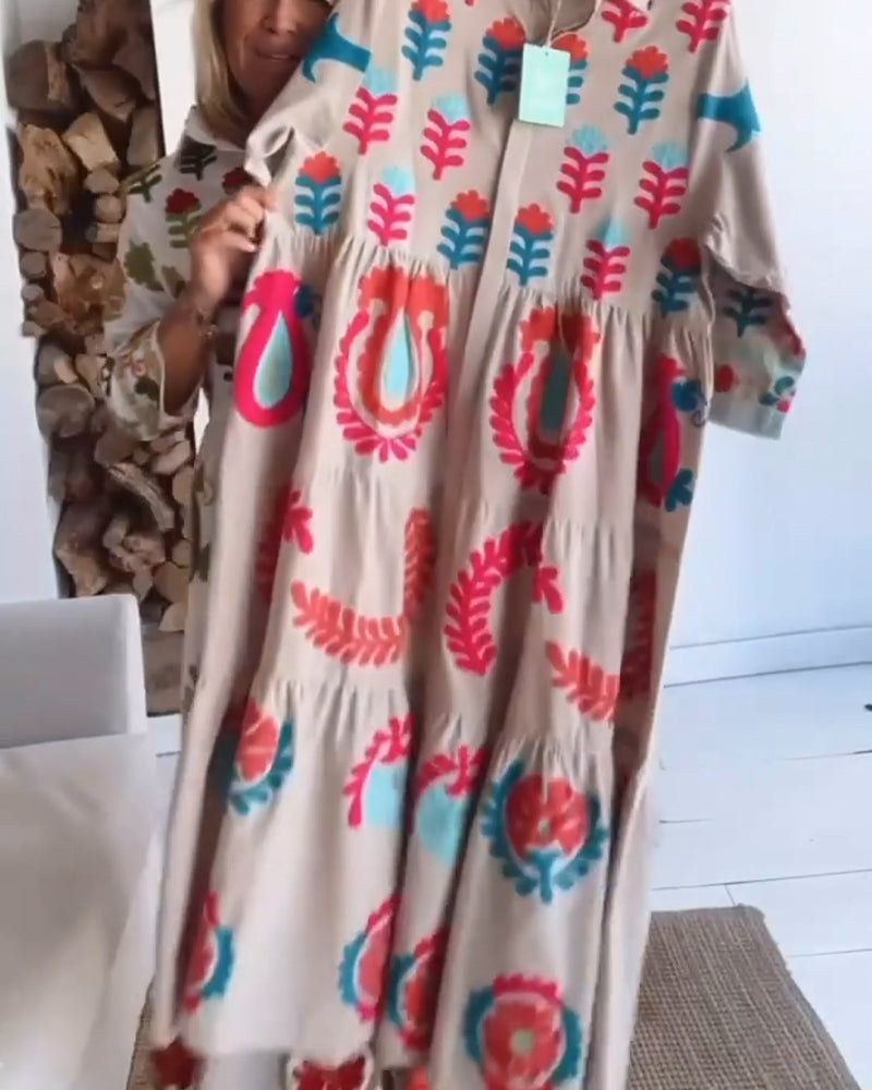 Elegant women's flowy midi dress featuring a vibrant floral graphic & lapel collar for summer.
