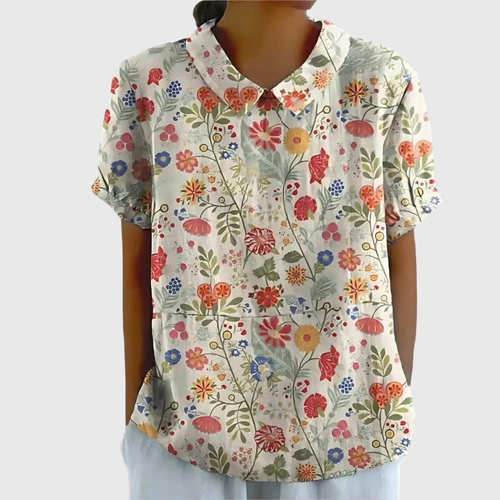 Elegant floral print women's top, offering chic apparel for both casual and dressier everyday style.