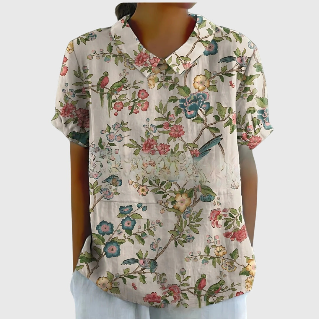 Close-up of the beautiful floral print on a women's long sleeve elegant blouse.