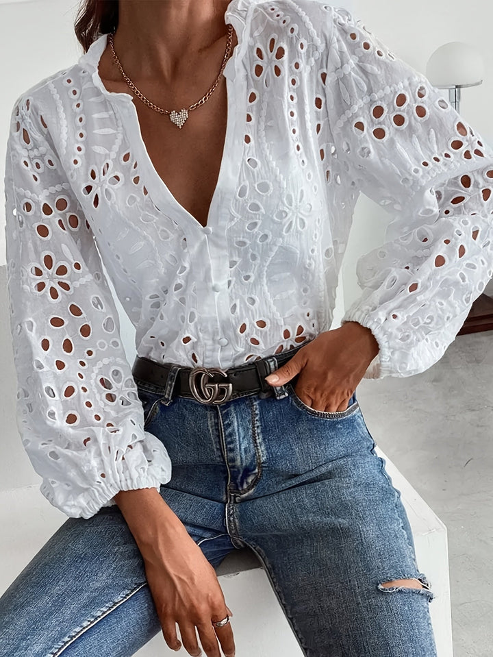 Women's elegant floral long-sleeve blouse with button closure, perfect for spring fashion.