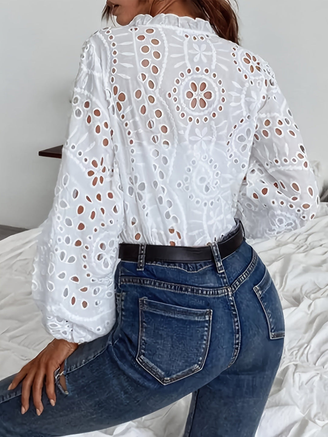 Stylish women's long-sleeve blouse with delicate floral embroidery and button closure, chic & comfortable.