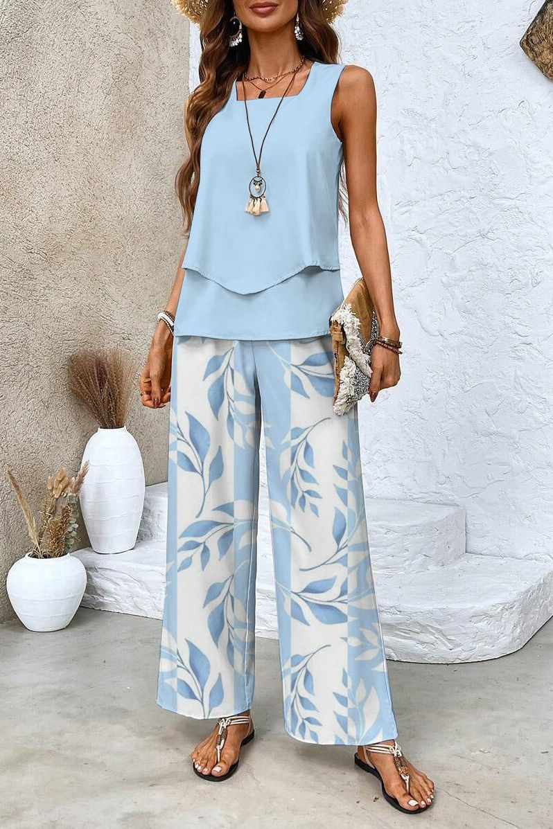Women's elegant floral print top & trouser set. Stylish two-piece outfit for spring/summer fashion.