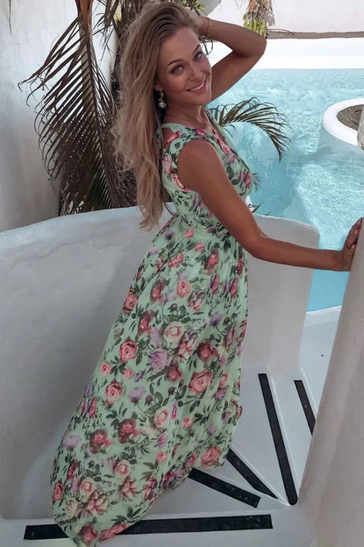 Women's comfortable floral print wrap maxi dress. A versatile long summer dress for casual or elegant wear.