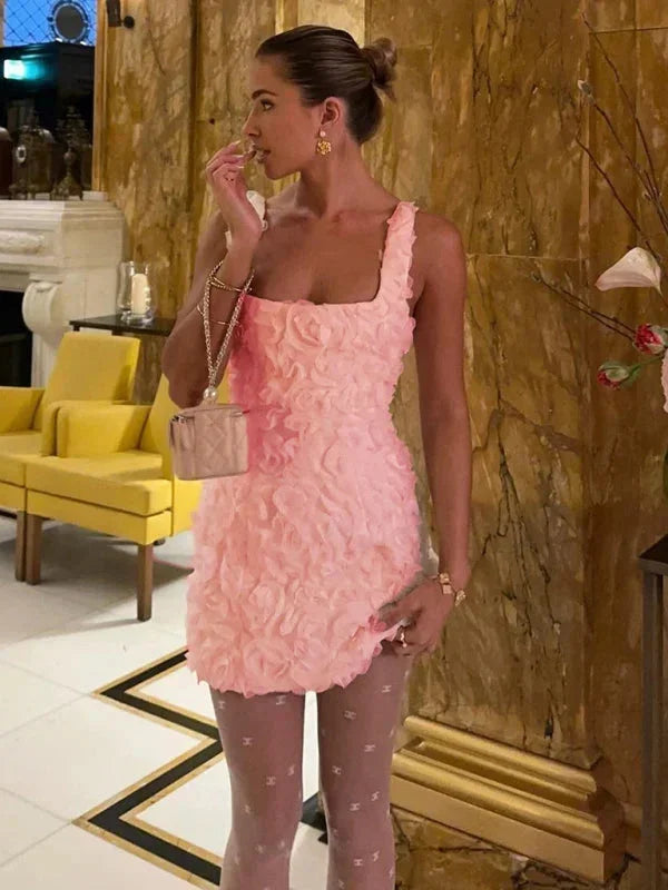 Sleeveless slim fit floral mini cocktail dress with beautiful textured design.
