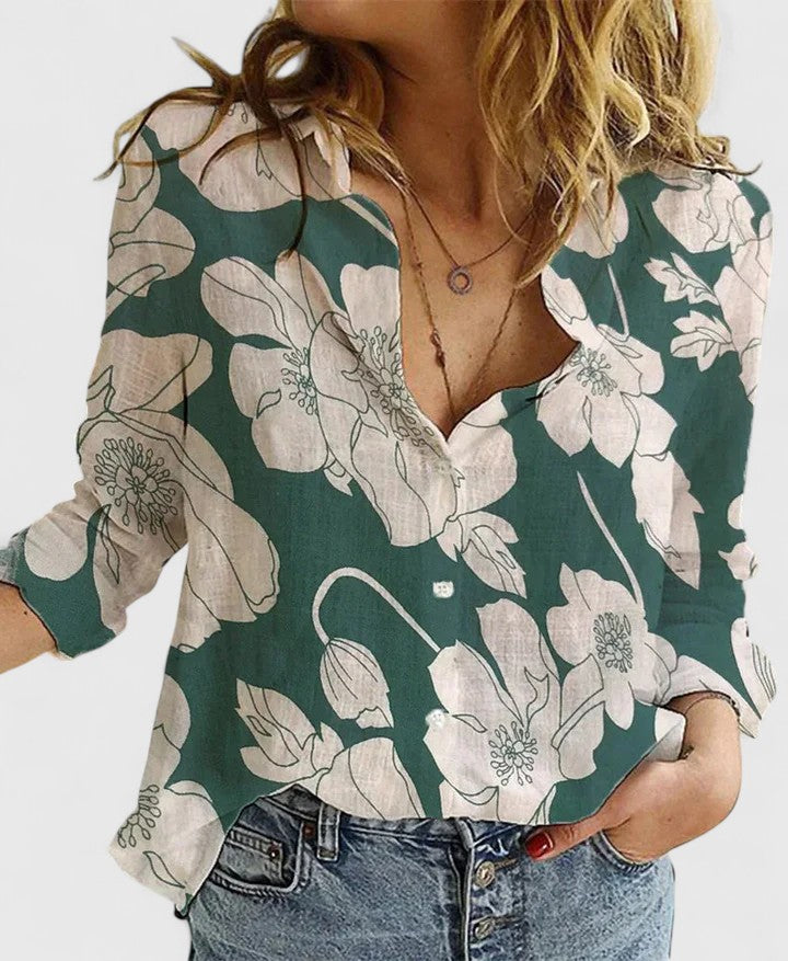 Stylish women's blouse with vibrant floral print, V-neck, and long sleeves; versatile fashion.
