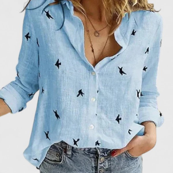 Flattering V-neck floral long sleeve blouse for women, a stylish top for office or casual wear.