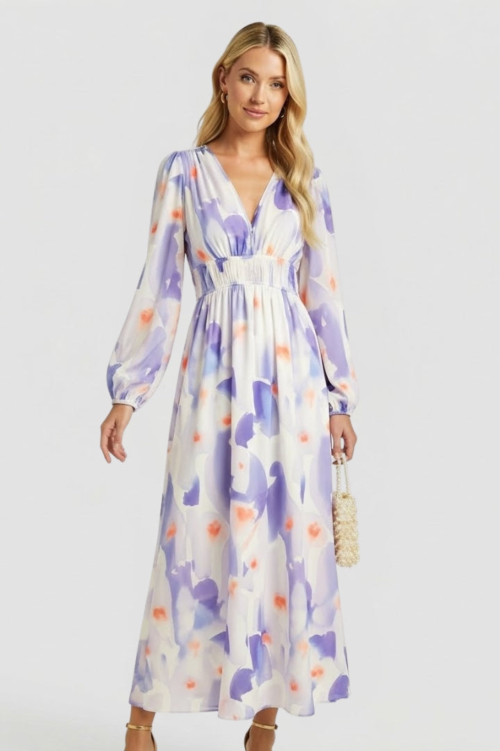Women's flowy floral print maxi dress, V-neck, long sleeve, perfect for warm weather.