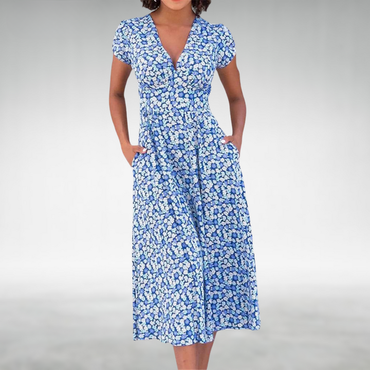 Women's elegant floral V-neck midi dress. Features a beautiful all-over floral pattern & comfortable short sleeves.