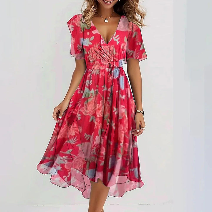 Stylish women's floral print midi wrap dress with flutter sleeves, designed for comfort and chic occasion wear.